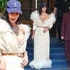 Kim Kardashian makes bizarre fashion choice as she teams busty feathered gown with a baseball cap for lunch with suited and booted Kris Jenner after testifying in jewellery heist trial
