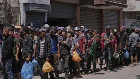 At least 21 Palestinians killed at Gaza aid hub as witnesses say Israeli troops fired on crowd