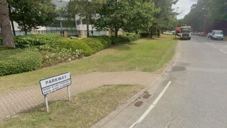 Woman stabbed in stomach at office left fighting for her life as man, 37, arrested for attempted murder