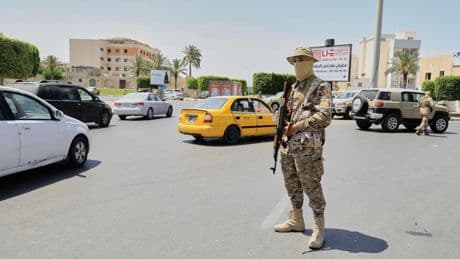 A warlord and 6 other people killed as militia infighting rocks Libya's capital, officials say