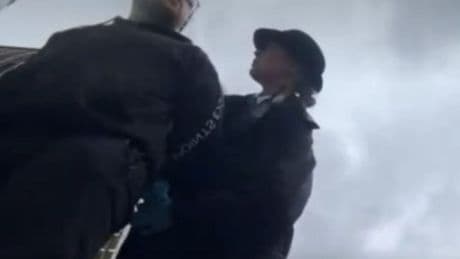 Chaos at Tom Cruise’s Mission Impossible premiere as anti-Scientology protesters are cuffed & bundled away by cops