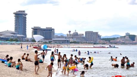 North Koreans swim and play at a beach resort touted as a boost for tourism