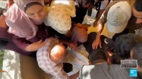 Israeli fire killed dozens near aid centre, Gaza rescuers say