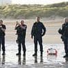No fish deal until France gets serious on Channel boats: Tories urge PM to suspend EU deal amid fury at 'shocking' scenes of police 'waving off' hundreds of migrants near Calais