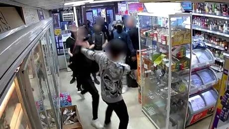 Feral masked teen gang batter shop worker to steal vapes and fizzy juice