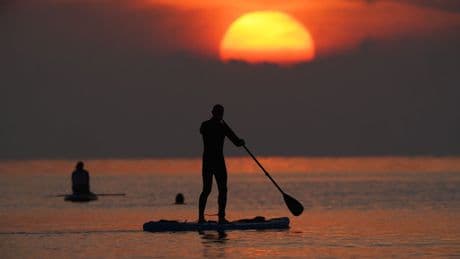 Russia detains tourist who entered country on paddle board