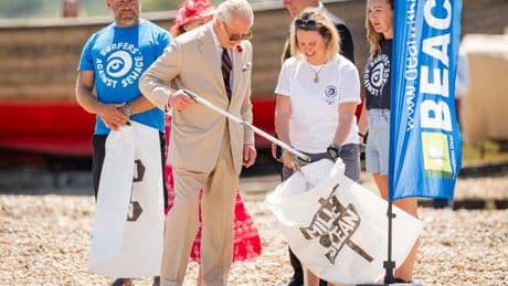 King Charles gets his hands dirty on litter clean up as he hears of traumatic rescue