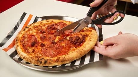 The right way to eat pizza, according to Italians - and it's not with a knife and fork