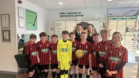 Specsavers in Larkhall hand over £1500 donation to Mill United FC for new strips