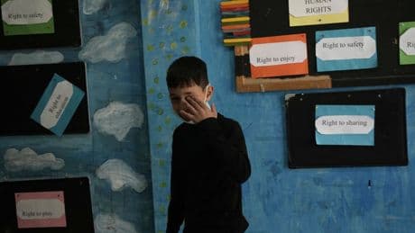 AP PHOTOS: Israel police fire tear gas into Palestinian schoolyard in Jerusalem