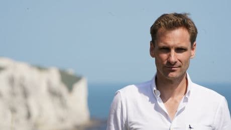 Chris Philp pelted with bottles and has knife pulled on him during trip to French migrant camp