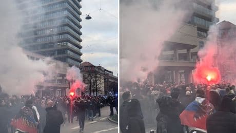 Tausend serbische Fans marschieren durch München und hüllen Stadt in roten Rauch