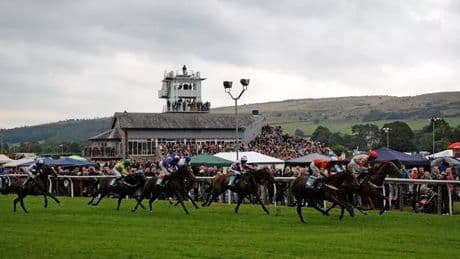 Two people taken to hospital after horse collides with spectators at Cartmel races