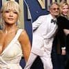 Rita Ora's glossy look turns heads as she third wheels husband Taika Waititi - while he cosies up to a VERY famous star on the Emmys red carpet
