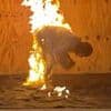 A real trail-blazer! UK therapist breaks world record for most backflips... while on FIRE