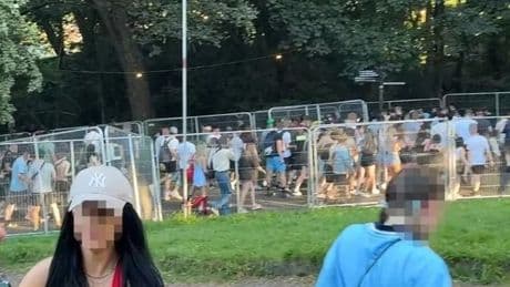 Oasis fans without tickets storm barriers of Manchester gig as police step in