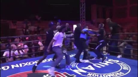 Shocking moment boxing referee is viciously attacked by several men in ring after fight before he is sent flying