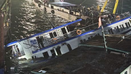 At least 35 dead after tourist boat packed with children capsizes in Vietnam as boy, 14, survives hours trapped in hull