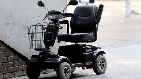 Man in 70s arrested as mobility scooter driver critically injured after 'punch'