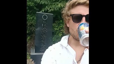 Australian embassy issues warning after tourist drinks offering at Japanese burial site