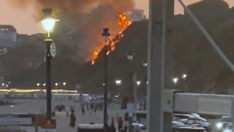 Moment fire erupts on beach as major blaze seen along tourist hotspot seafront with fears it was started deliberately