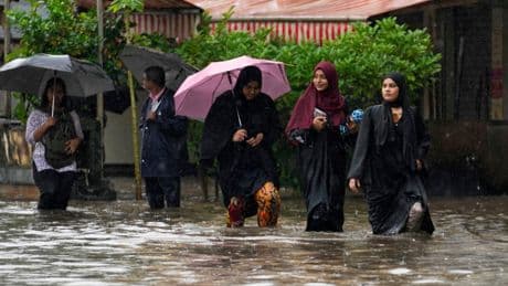Record rains bring Mumbai to a standstill, in photos