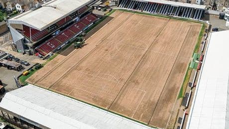 EFL stadium looks unrecognisable as pitch is ripped up for maintenance work and fans spot where turf has been dumped