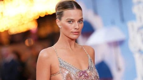 Margot Robbie stuns in risqué see-through dress on red carpet with Colin Farrell