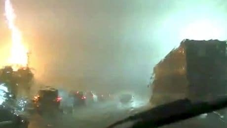 Dash cam footage captures pillar of fire sparked by dramatic lightning strike