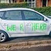 Vandals wreck 41 cars in one night as they smash windows and spray paint bizarre messages on vehicles