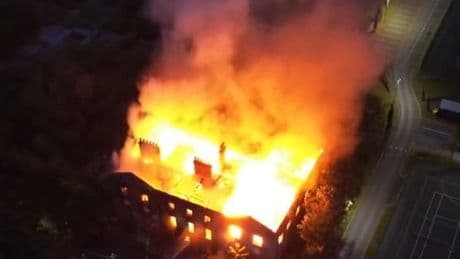 Firefighters battle to save Woolton Hall as roof collapses in Liverpool inferno