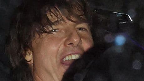 Tom Cruise desperately tries to hide girlfriend Ana de Armas as they leave Beckham bash