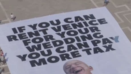Protesters unfurl huge anti-Bezos banner in Venice ahead of Amazon billionaire’s wedding