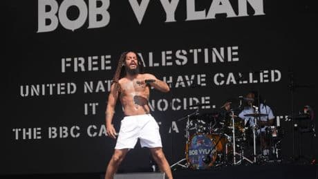 Glastonbury says chants by Bob Vylan ‘crossed the line’ as police assess footage