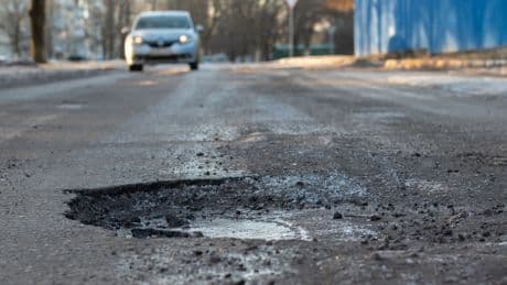 Government claims car interventions will save &#163;500 a year - but only if you hit a pothole