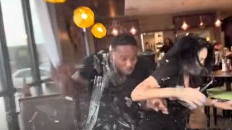 Couple escape death after car crashes into restaurant table during influencer filming
