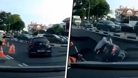 Auto opgeslokt door sinkhole in Singapore