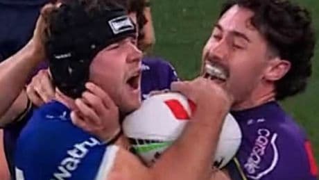 Footy fans stunned after bizarre penalty for 'head rub' as Melbourne Storm took on the Bulldogs