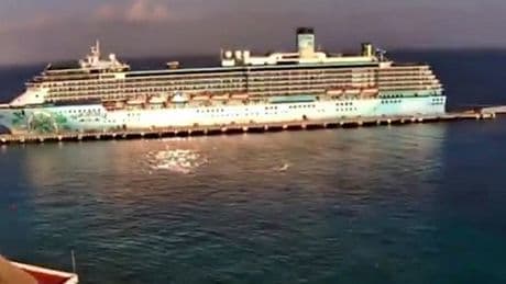 UFO zooms past cruise ship at ‘almost imperceptible speed’ in eerie video as onlookers gasp ‘what was that?!’