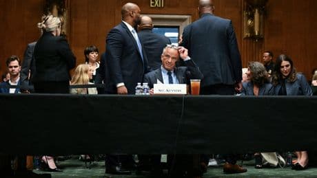 RFK Jr visibly startled by protesters amid angry confrontations over cuts and vaccines at health hearing