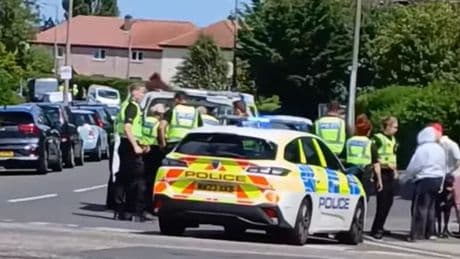 Huge police response as officers swoop on busy road in Edinburgh