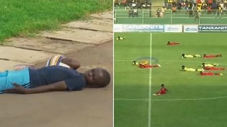 Play dead! Footballers suddenly hit the deck as match is suspended for bizarre reason