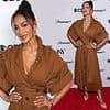 Nicole Scherzinger put on a very busty display in a plunging brown dress as she enjoys Tony Awards nominees party following 'Anna Wintour's Met Gala snub'