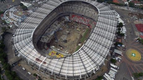 World Cup stadium looks totally unrecognisable with cranes on pitch and seats ripped out