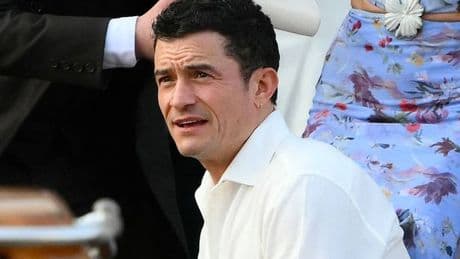 Orlando Bloom flies solo at Jeff Bezos' wedding celebrations after 'split' from Katy Perry