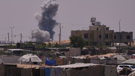 At least 32 Palestinians killed by Israeli gunfire near Gaza aid sites, say reports
