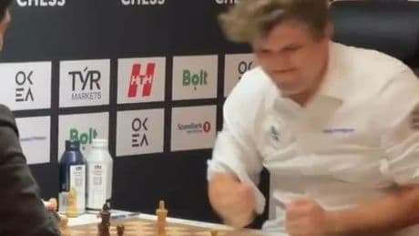 Fans ‘can’t stop watching’ moment chess grandmaster loses his cool and slams table in disgust after conceding defeat