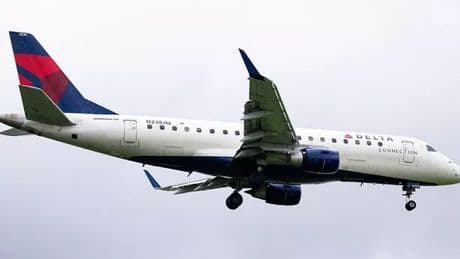 Moment shaken Delta pilot apologises  after jet almost crashes with B-52 bomber