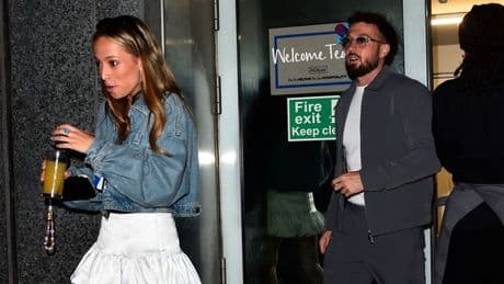 Louis Tomlinson and Sam Thompson seen arriving back at hotel after Soccer Aid near miss