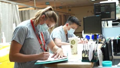 Health-care workers urge Alberta to halt plan limiting free COVID-19 vaccines